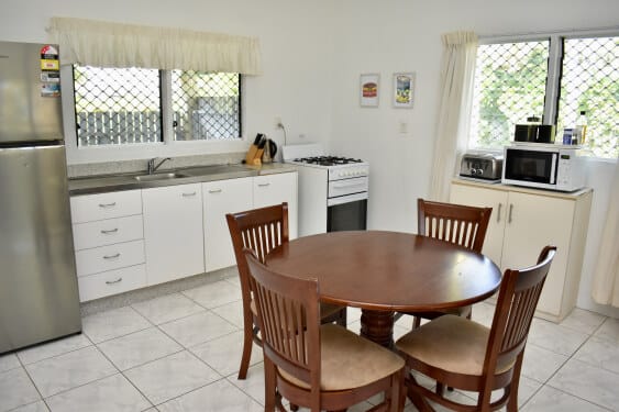 The kitchen is open plan and blends into the dining area.